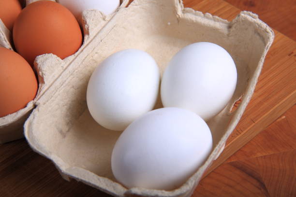 istock Fresh Organic Eggs in a Carton 882569978