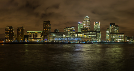 LONDON, UK - JANUARY 29, 2016: Night time skyline shot of the office buildings in Canary Wharf, Docklands, London, England