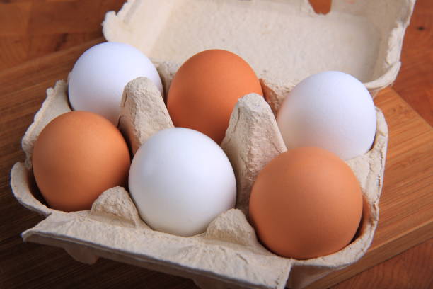 istock Fresh Organic Eggs in a Carton 882574704