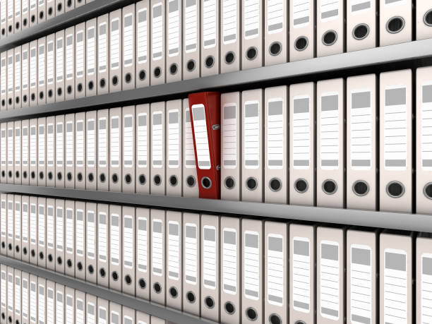 red ring binder standing out from a row of files