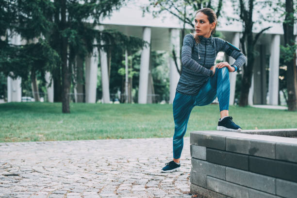 istock Woman stretching outdoors 882584760