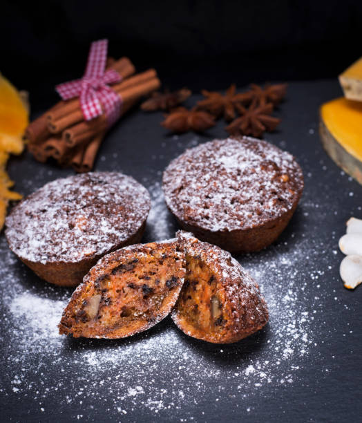 istock Pumpkin cupcakes are sprinkled with powdered sugar 882598466