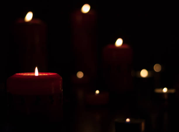 istock Christmas Candles lit at night. 882614610