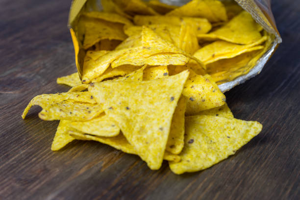 istock Nachos corn chips with classic tomato salsa. Fresh cold beer is perfect with savory snacks. 882615020