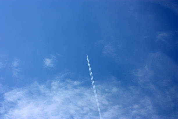 istock Inverse track from airplane on a blue cloudy sky 882649784