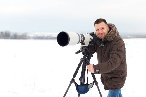 istock Photographer in winter 882652062