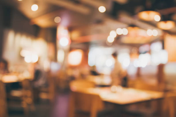 istock Restaurant cafe or coffee shop interior with people abstract blur background 882652174