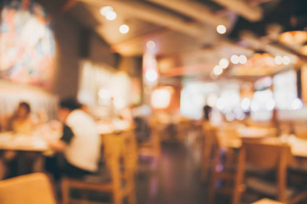 istock Restaurant cafe or coffee shop interior with people abstract blur background 882652176