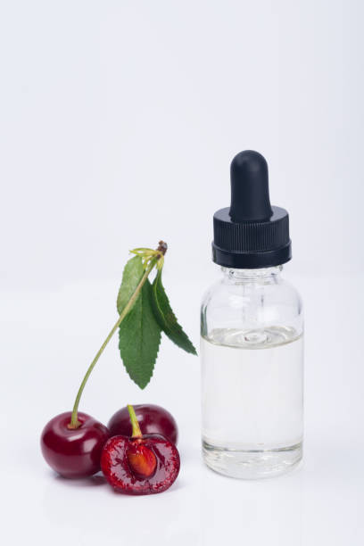 istock aroma and flavor enhancer next to a ripe cherry, on a white background 882652352