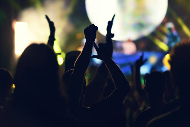 istock Crowd rocking during a concert with raised arms. 882652576