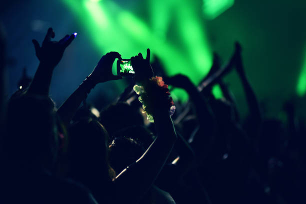 istock Crowd rocking during a concert with raised arms. 882652630