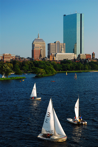 Boston, MA, USA August 17, 2009 Community Boating in Boston allows folks to rent sailboats to cruise on the Charles River in front of the skyline of the city