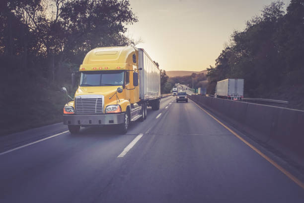 istock Yellow 18 wheeler truck on highway 882664260