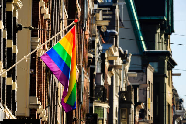 istock Rainbow banner on a house facade in Amsterdam 882666920