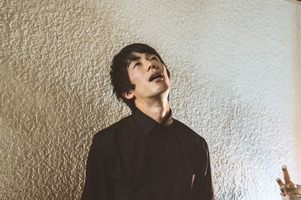 istock Depressed man in the dark 882667142