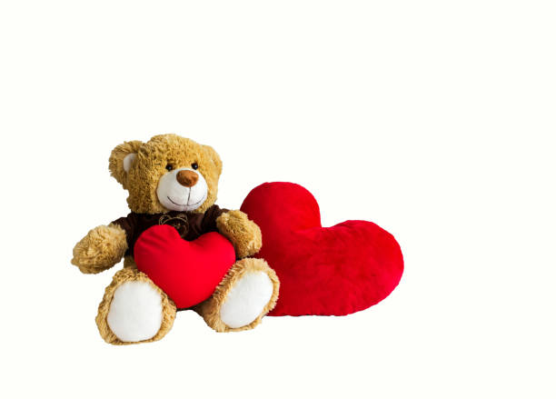 istock Isolate bear doll with couple big red heart on white background 882667180