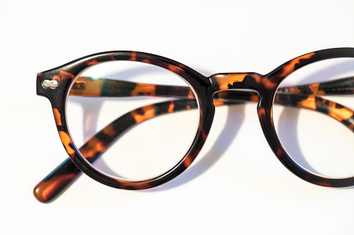 Reading glasses on a white background macro close up shot