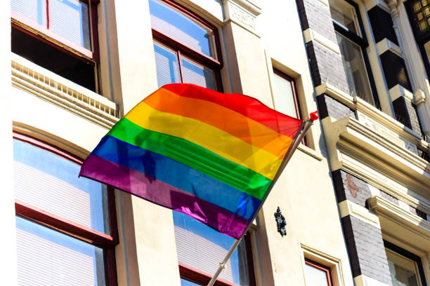 istock Rainbow banner on a house facade in Amsterdam 882673900