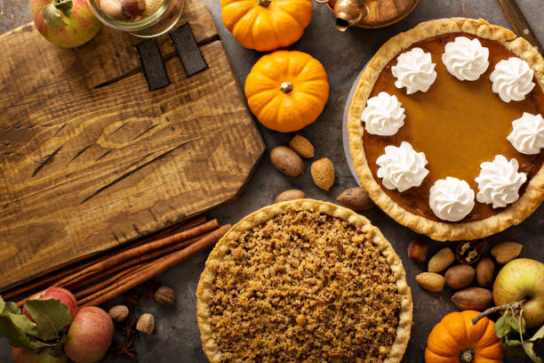 istock Fall traditional pies pumpkin, pecan and apple crumble 882690560