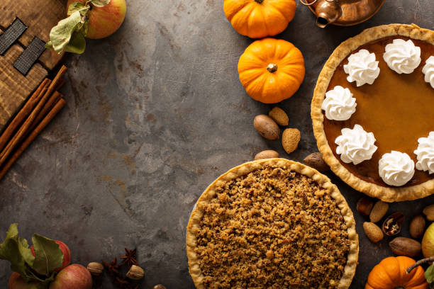 istock Fall traditional pies pumpkin, pecan and apple crumble 882690714