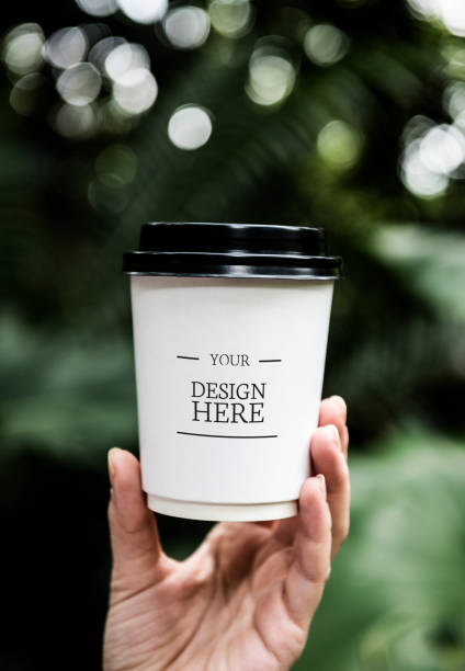 istock Closeup of hand holding paper cup 882693484