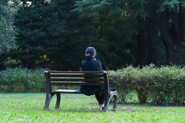 istock Depressed woman in the park 882698694