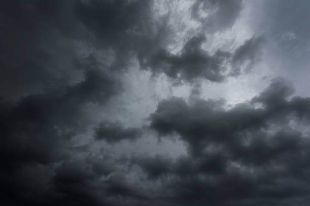 istock Black cloud and thunderstorm before rainy, Dramatic  black clouds and dark sky 882701252