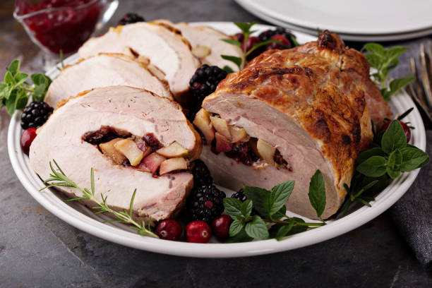 istock Roasted pork loin stuffed with apple and cranberry 882701462