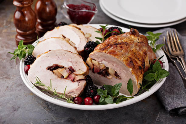istock Roasted pork loin stuffed with apple and cranberry 882701520
