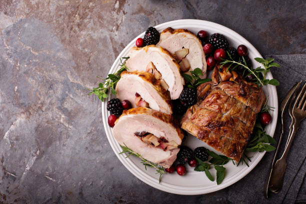istock Roasted pork loin stuffed with apple and cranberry 882701626