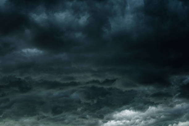 istock Dark sky and black clouds, Dramatic storm clouds before rainy, Closeup black cloud motion 882706616