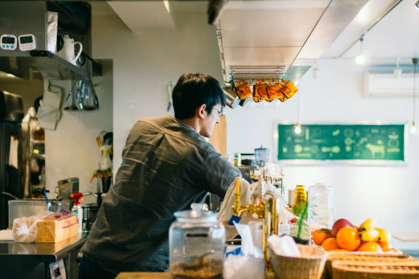 istock Barista Cleaning and Organizing at Cafe Counter 882720026