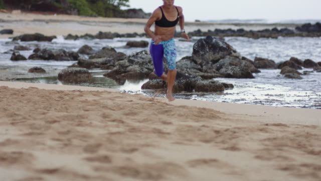 4K Slow Mo: Attractive Woman Sprinting Up the Beach