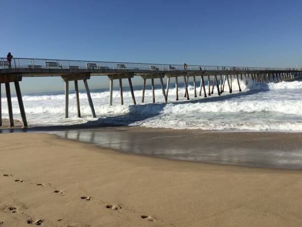 istock Waves at Hermosa Beach pier in Winter 882723072