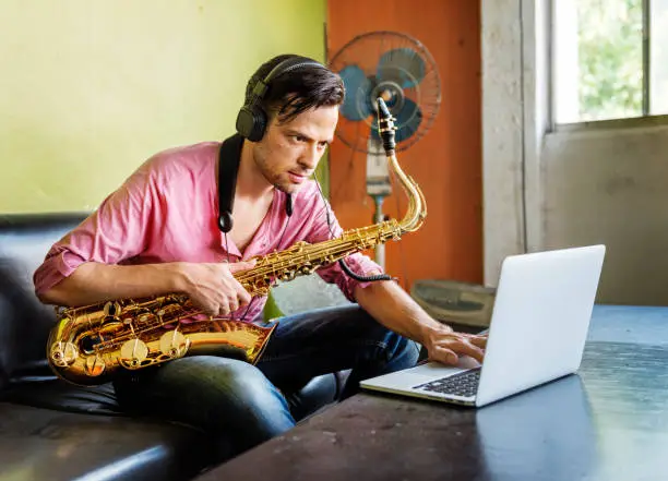 Photo of Jazzman Musical Artist Playing Saxophone Concept