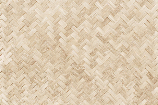 Old bamboo weaving pattern, woven rattan mat texture for background and design art work.