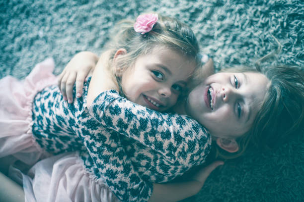 Cute little girls at home. Close up.