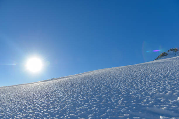 istock view of snowy mountains and winter sun 882795430