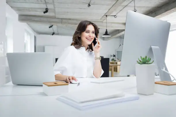 Photo of Businesswoman working in modern workplace