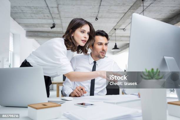 Business People Working Together On Computer Stock Photo - Download Image Now - Office, Computer Monitor, Desktop PC