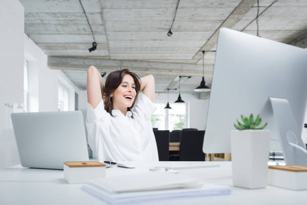istock Businesswoman relaxing in office during break 882802646