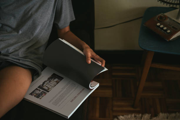 istock Woman relaxing with a magazine 882809574