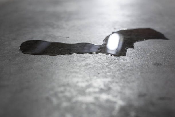 istock Puddle of Water, Car, Asphalt, Parking 882809728