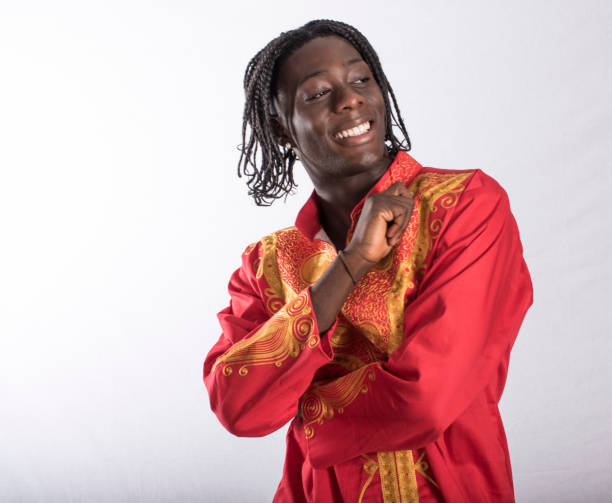 istock Young black man from Sierra Leone smiling and covering himself. 882809804