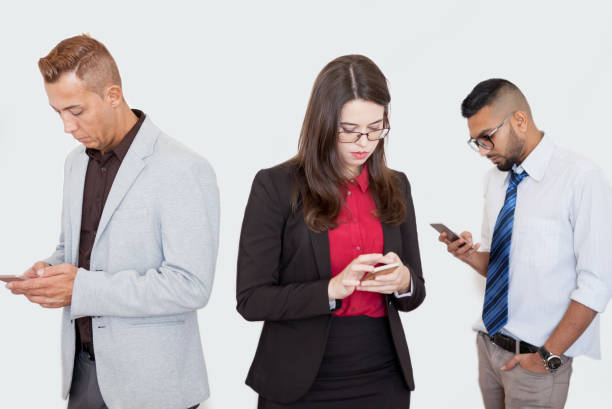 istock Serious partners using smartphones at meeting 882812648