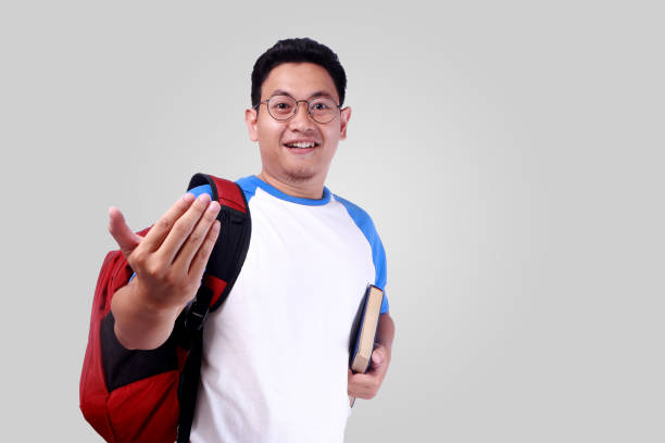 istock Happy Smiling Young Male Asian Student 882812802