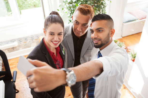 istock Positive business friends taking self-portrait 882812840