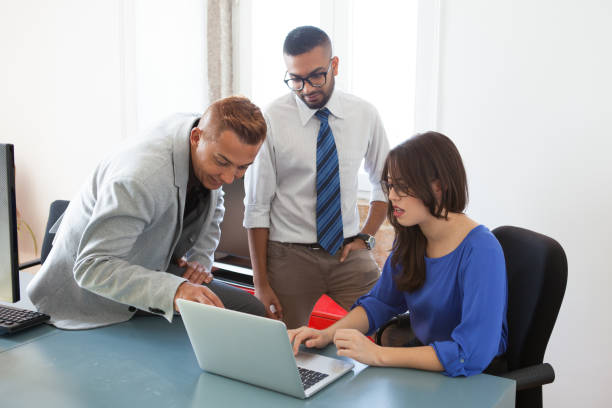 istock Young employees arguing about strategy at meeting 882812878