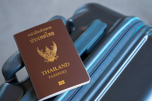 istock Thai passport on suitcase, Travel concept 882817446