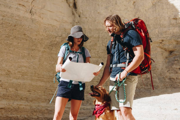 istock Couple hiking together in the wilderness 882824834